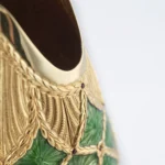 Detail of the Stefano Vigni's Champagne bottle cover Emerald. Inspired by the renowned Fabergé Eggs