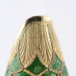Detail of the Stefano Vigni's Champagne bottle cover Emerald. Inspired by the renowned Fabergé Eggs