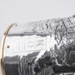 Handcrafted by the florentine master goldsmith Giuliano Foglia, this is a detail of Giganti Champagne bottle cover lid detail featuring a meticulously detailed scene from Dante's Divine Comedy