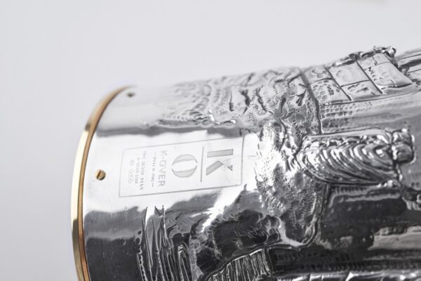 Handcrafted by the florentine master goldsmith Giuliano Foglia, this is a detail of Giganti Champagne bottle cover lid detail featuring a meticulously detailed scene from Dante's Divine Comedy