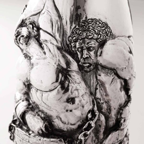 Handcrafted by the florentine master goldsmith Giuliano Foglia, this is a little detail of Giganti Champagne bottle cover lid detail featuring a meticulously detailed scene from Dante\'s Divine Comedy