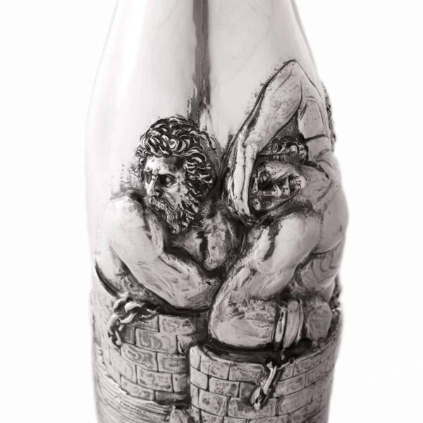 Handcrafted by the florentine master goldsmith Giuliano Foglia, this is a little detail of Giganti Champagne bottle cover lid detail featuring a meticulously detailed scene from Dante\'s Divine Comedy