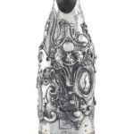 Handcrafted by the florentine master goldsmith Giuliano Foglia, this is the front of Fantasy Champagne bottle cover that has intricately chiseled a series of surrealistic images