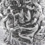 Silver champagne bottle cover with bas-relief inspired by mythological bacchanal scene.