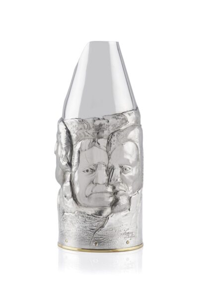 Artistic silver champagne bottle cover, finely engraved with expressive human faces emerging from textured surfaces, creating a sculptural effect that blends contemporary design and traditional craftsmanship.