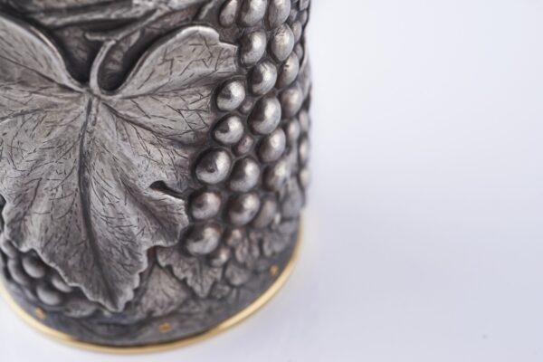 Detail of the Champagne bottle cover Grapes