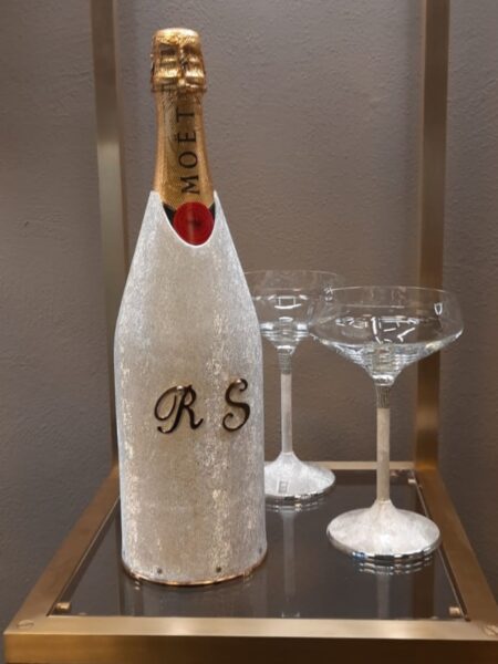 Personalized champagne bottle cover with wedding initials and two champagne glasses
